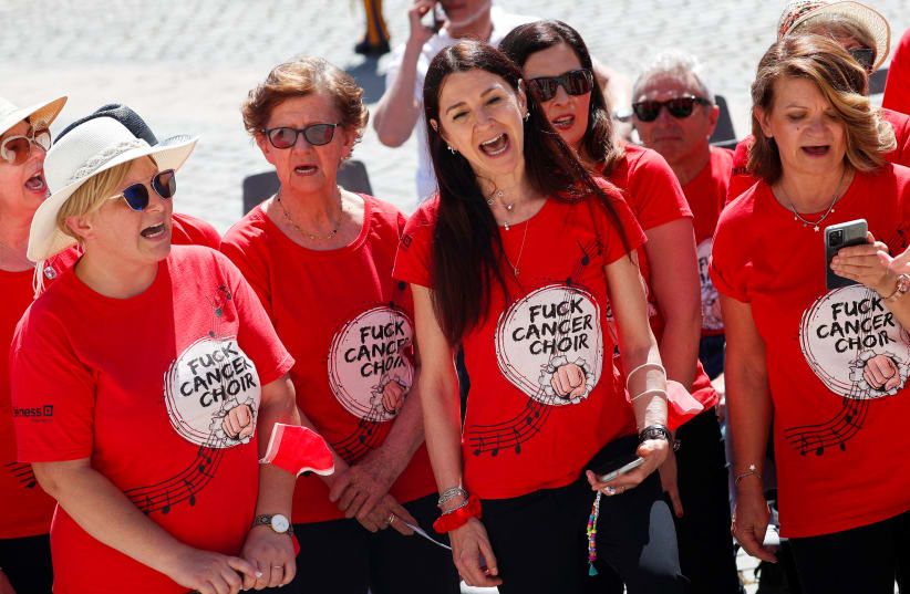 Members of the "Fuck Cancer Choir" perform at the weekly general audience held by Pope Francis at the Vatican June 8, 2022. (photo credit: REUTERS/GUGLIELMO MANGIAPANE)