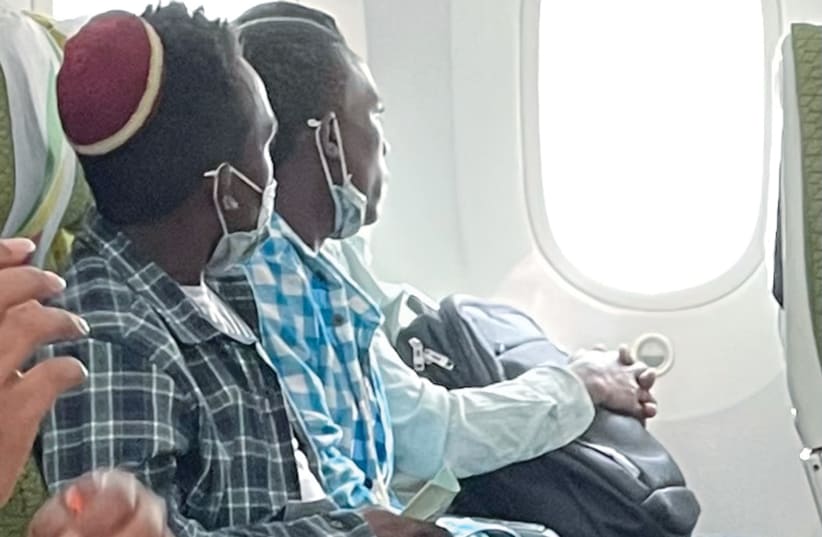  TWO OF the newest immigrants from Ethiopia pondering through the jetliner window about the past and anticipating their future. (photo credit: Charles O. Kaufman)