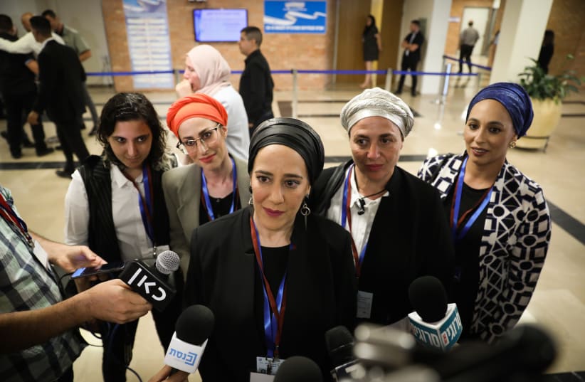  Women from the Ambash cult speak outside the election committee meeting where political parties running for a spot in the upcoming Israeli elections, arrive to present the party list for the September 2019 elections, at the Knesset, the Israeli parliament in Jerusalem, on August 1, 2019.  (photo credit: NOAM REVKIN FENTON/FLASH90)