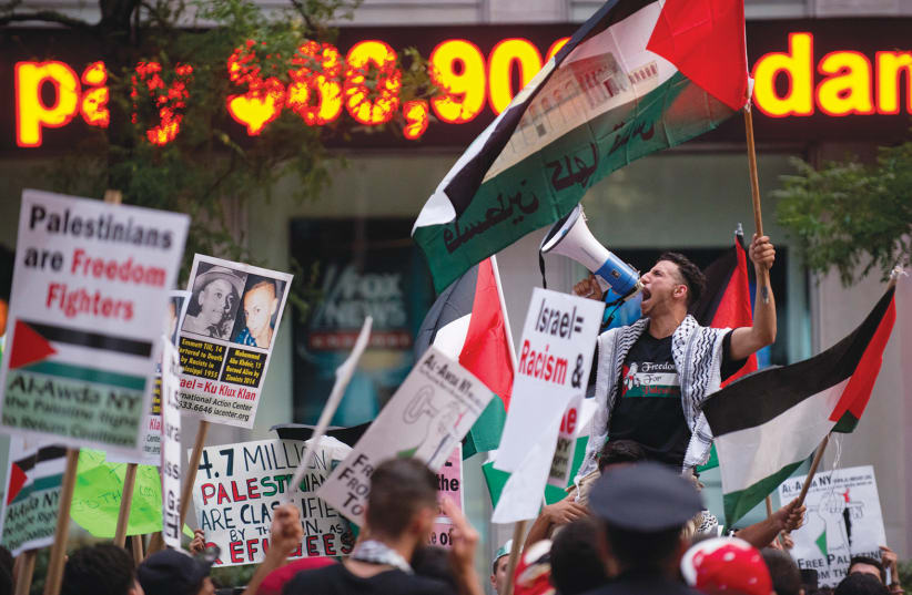  A MAN shouts ‘Free Palestine’ during a march in midtown Manhattan. Activists in the West care more about attacking Israel than they do about LGBTQ+ Palestinians, says the writer. (photo credit: Darren Ornitz/Reuters)