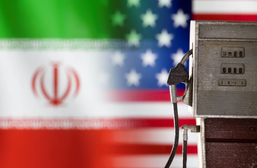  Model of petrol pump is seen in front of US and Iran flag colors in this illustration taken March 25, 2022 (photo credit: REUTERS/DADO RUVIC/ILLUSTRATION)