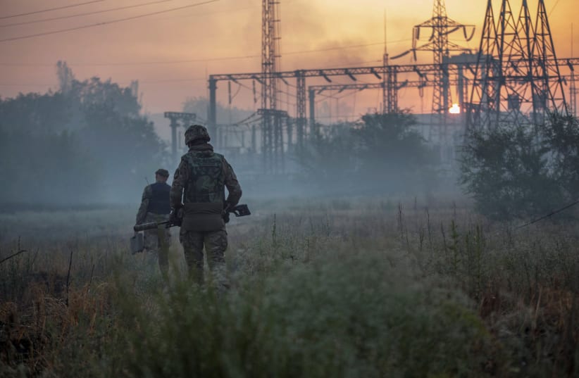 Ukrainian service members patrol an area in the city of Sievierodonetsk, as Russia's attack on Ukraine continues, Ukraine, June 20, 2022. (photo credit: REUTERS/OLEKSANDR RATUSHNIAK)