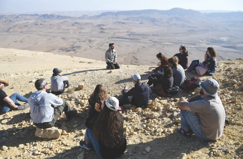 THE WRITER holds a discussion with grassroots leaders, at a retreat in Mitzpe Ramon.  (photo credit: ADI SARAGA KENN)