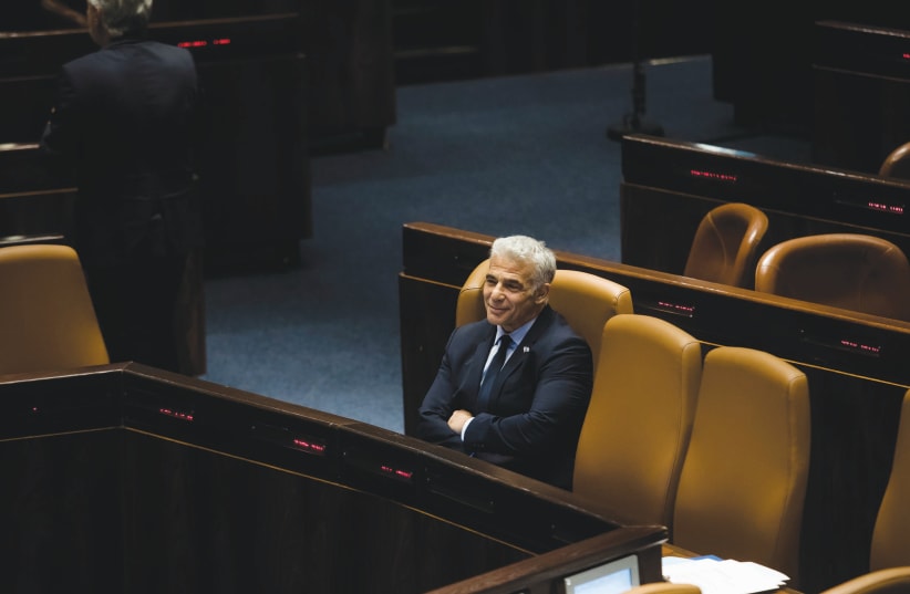  WILL HE be smiling after the election? Yair Lapid this week at the Knesset.  (photo credit: AMIR LEVY)