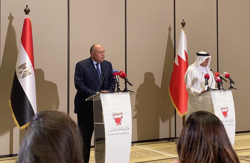 Egyptian Foreign Minister Sameh Shoukry and Bahraini Foreign Minister Dr. Abdullatif al-Zayani speak at a joint press conference in the Bahraini capital Manama, on 29 June 2022. (photo credit: HUDHAIFA EBRAHIM/THE MEDIA LINE)