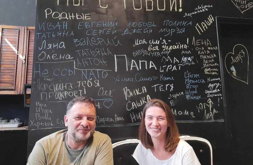  MICHAEL TEPLITSKY and Anna Pereleshina at Malenky Theater. During a special reading of Ukrainian plays held in Tel Aviv, patrons wrote names and heartfelt descriptions of relatives and friends left behind in Ukraine. (photo credit: HAGAY HACOHEN)