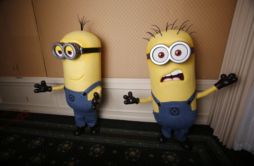  Two life-size minion characters wait for actor Steve Carell to arrive while promoting his upcoming movie "Despicable Me 2" in Los Angeles, California June 14, 2013. (photo credit: REUTERS/MARIO ANZUONI)