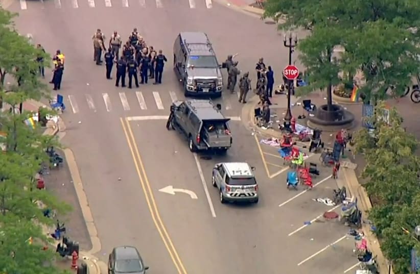  Police deploy after gunfire erupted at a Fourth of July parade route in the wealthy Chicago suburb of Highland Park, Illinois, U.S. July 4, 2022 in a still image from video. (photo credit: ABC affiliate WLS/ABC7 via REUTERS)