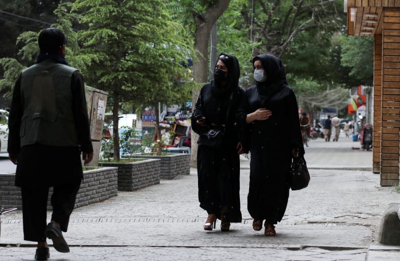  Afghan women walk on a street in Kabul, Afghanistan, May 9, 2022. (photo credit: REUTERS)