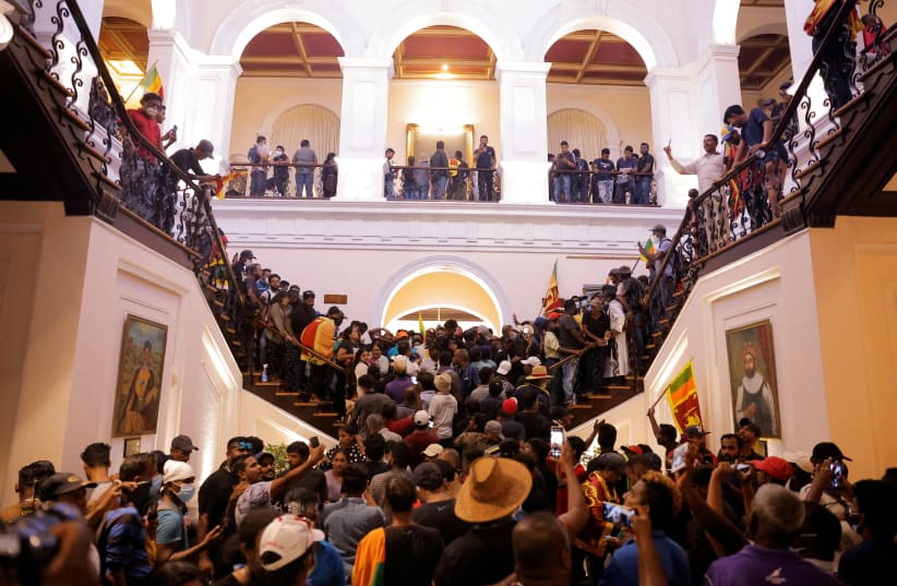  Demonstrators protest inside the President's House, after President Gotabaya Rajapaksa fled, in Colombo (photo credit: REUTERS)