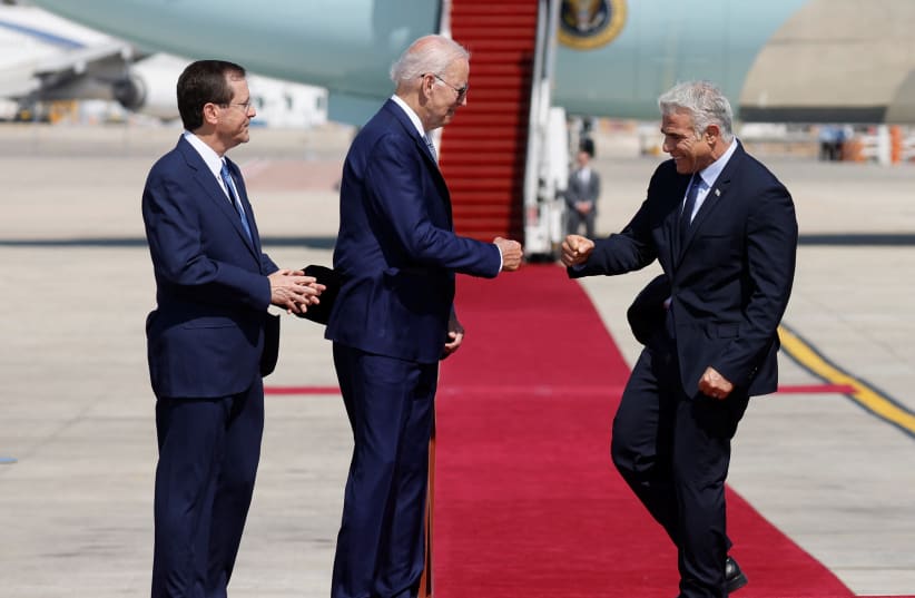  President Isaac Herzog, US President Joe Biden and Israeli Prime Minister Yair Lapid participate in a welcoming ceremony at Ben Gurion International Airport in Lod, near Tel Aviv, Israel, July 13, 2022 (photo credit: REUTERS/AMIR COHEN)
