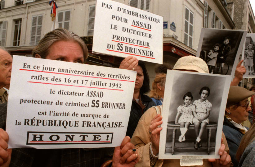  MEMBERS OF Jewish organizations protest the sheltering of convicted Nazi criminal Alois Brunner by Syrian president Hafez Assad, 1998. The protest was near the Syrian Embassy in France, during a visit there by Assad. (photo credit: REUTERS)