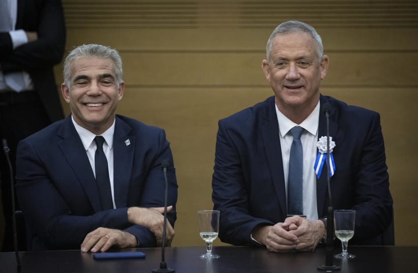 Blue and White party co-chairmen Benny Gantz and Yair Lapid at the party faction meeting during the opening session of the 22nd Knesset, following the September elections, October 3, 2019. (photo credit: HADAS PARUSH/FLASH90)