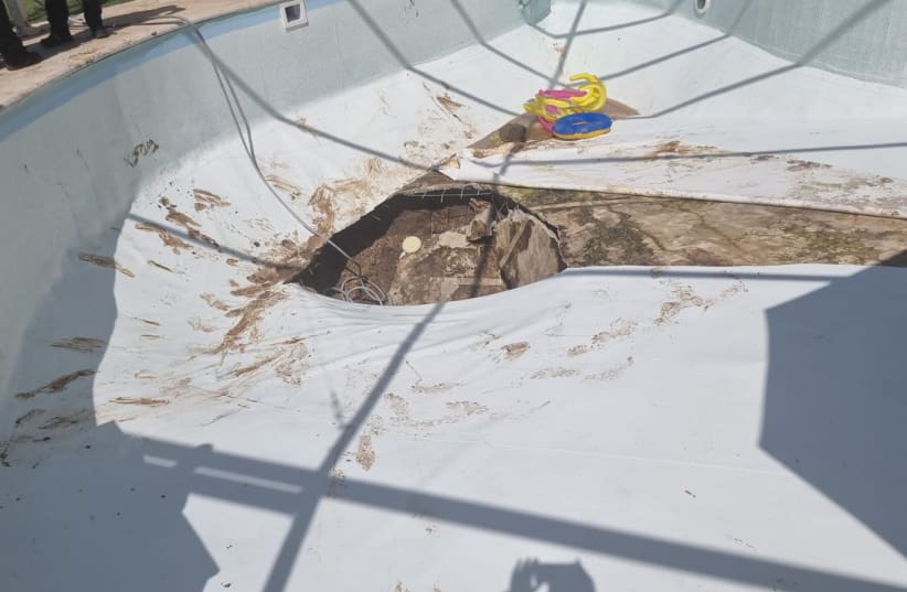  Sinkhole under a pool in Karmei Yosef, July 21, 2022. (photo credit: ISRAEL POLICE)