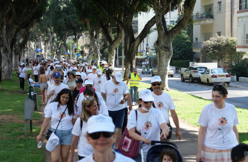  Sarcoma Awareness march walks through Tel Aviv's Sederot Chen on their way to Habima Square, July 1, 2022. (photo credit: LIOR TZUR)