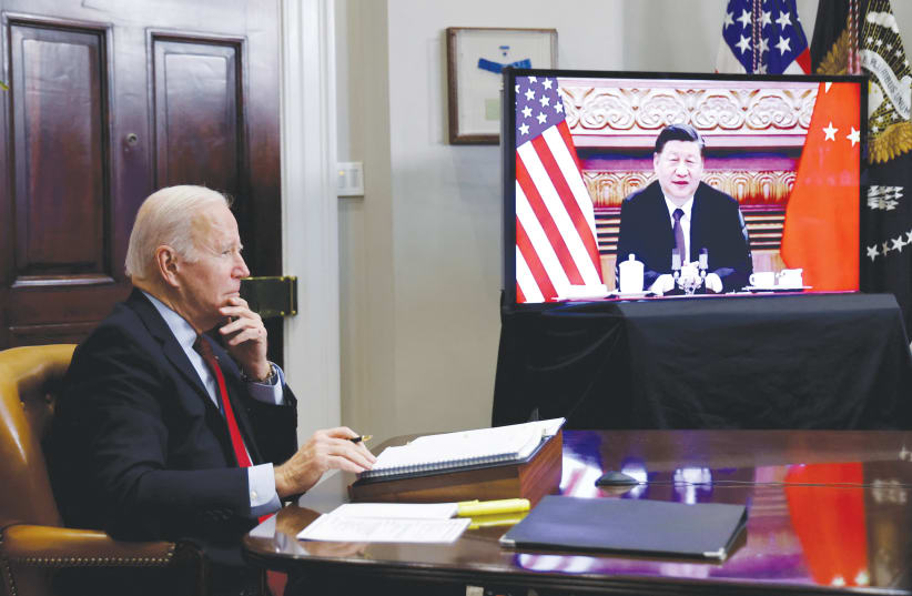  US PRESIDENT Joe Biden speaks from the White House last year with Chinese President Xi Jinping. (photo credit: JONATHAN ERNST/REUTERS)