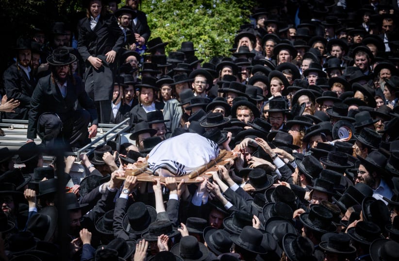  Ultra orthodox jewish men attend the funeral of Grand Rabbi Yitzchok Tuvia Weiss "Gaavad", head of the Eidah Hachareidit, in Jerusalem on July 31, 2022,  Weiss passed away at the age of 95.  (photo credit: YONATAN SINDEL/FLASH90)