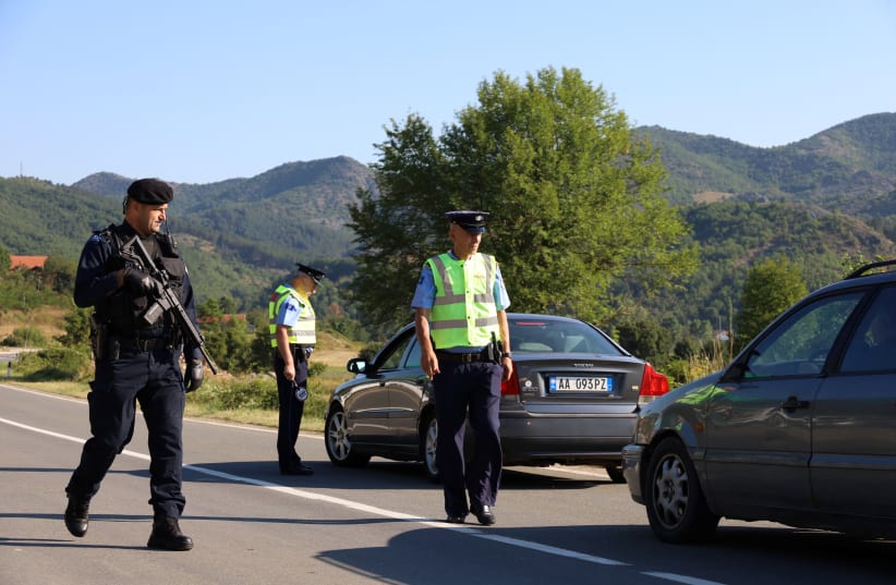  Kosovo police patrol a road in Zupce, Kosovo August 1, 2022. (photo credit: REUTERS/FATOS BYTYCI)