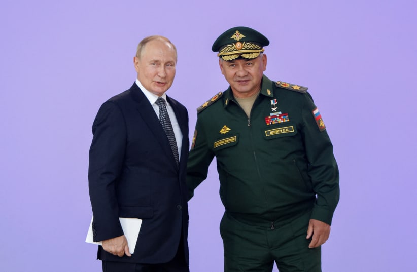Russian President Vladimir Putin and Defence Minister Sergei Shoigu attend a ceremony opening the international military-technical forum Army-2022 at Patriot Congress and Exhibition Centre in the Moscow region, Russia August 15, 2022. (photo credit: REUTERS/MAXIM SHEMETOV)