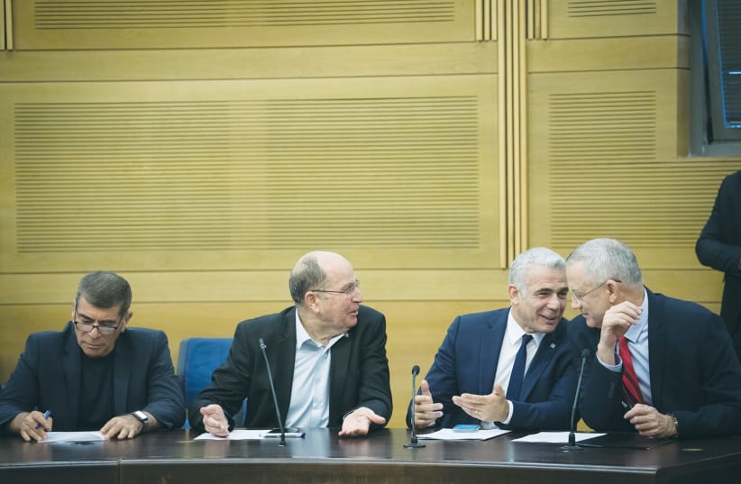  BLUE AND WHITE chairman Benny Gantz holds a meeting with then-faction leaders Yair Lapid, Moshe Ya’alon and Gabi Ashkenazi, in the Knesset, 2019. (photo credit: HADAS PARUSH/FLASH90)
