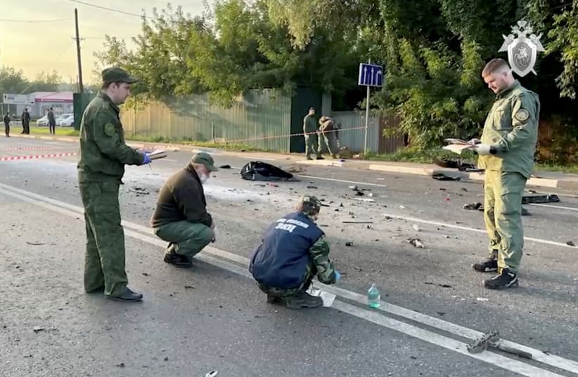  Investigators work at the site of a suspected car bomb attack that killed Darya Dugina, daughter of ultra-nationalist Russian ideologue Alexander Dugin, in the Moscow region, Russia August 21, 2022, in this still image taken from video. (photo credit: Investigative Committee of Russia/Handout via REUTERS)