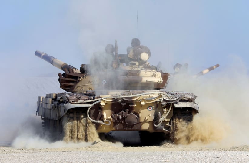  A military tank is seen during an Iranian Army exercise dubbed 'Zulfiqar 1400', in the coastal area of the Gulf of Oman, Iran, in this picture obtained on November 7, 2021. (photo credit: IRANIAN ARMY/WANA (WEST ASIA NEWS AGENCY)/HANDOUT VIA REUTERS)