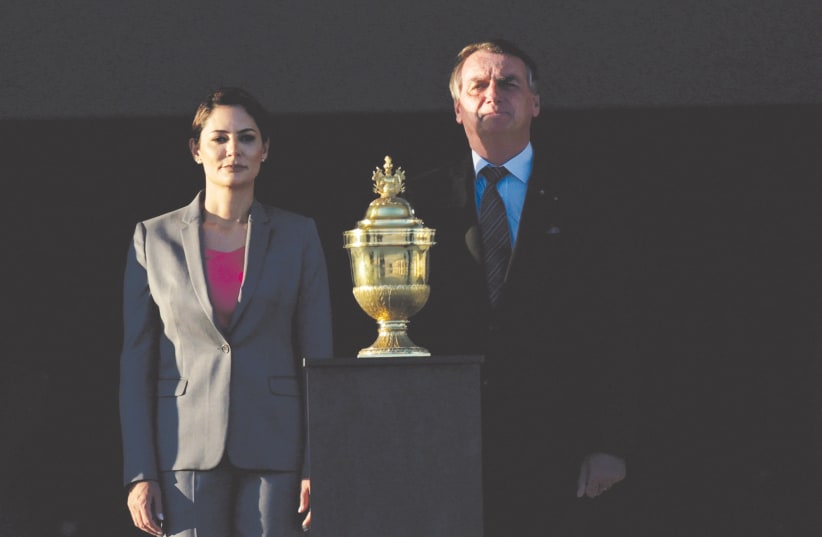  BRAZIL’S PRESIDENT Jair Bolsonaro takes part in a welcome ceremony for the urn with the heart of Portuguese monarch Dom Pedro I, who declared Brazil’s independence from Portugal 200 years ago, at the Planalto Palace in Brasilia, Brazil, earlier this week. (photo credit: UESLEI MARCELINO/REUTERS)