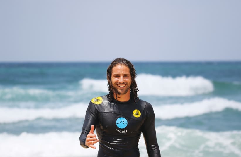  THE WRITER loves surfing in the sea and uses it as a tool for personal development among at-risk youth.  (photo credit: HAGAL SHELI)