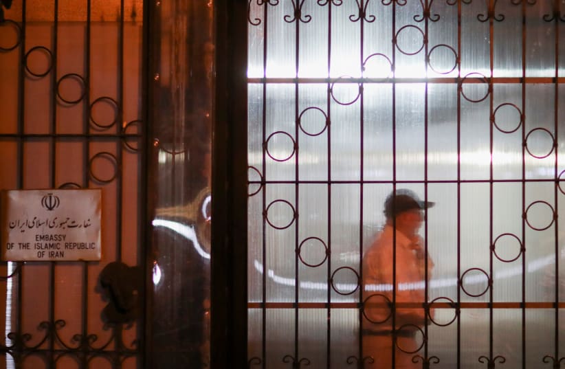  Personnel of the Embassy of the Islamic Republic of Iran can be seen through a closed door, as Albania cuts ties with Iran and orders diplomats to leave over cyberattack, in Tirana, Albania, September 7, 2022. (photo credit: REUTERS/FLORION GOGA)
