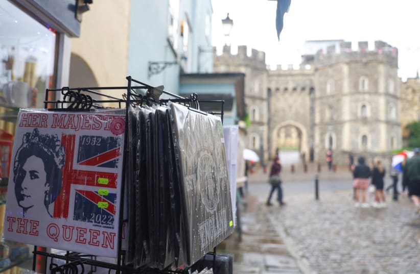  A souvenir with an image of Britain's Queen Elizabeth is displayed, amid concerns over Queen Elizabeth's health, in Windsor, Britain, September 8, 2022.  (photo credit: REUTERS/HANNAH MCKAY)