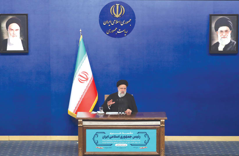 IRANIAN PRESIDENT Ebrahim Raisi speaks during a press conference in Tehran, on August 29. Today, Raisi said that reviving a 2015 deal with world powers is meaningless unless the UN nuclear watchdog puts an end to the probe on undeclared sites in the country. (photo credit: STR/AFP via Getty Images)