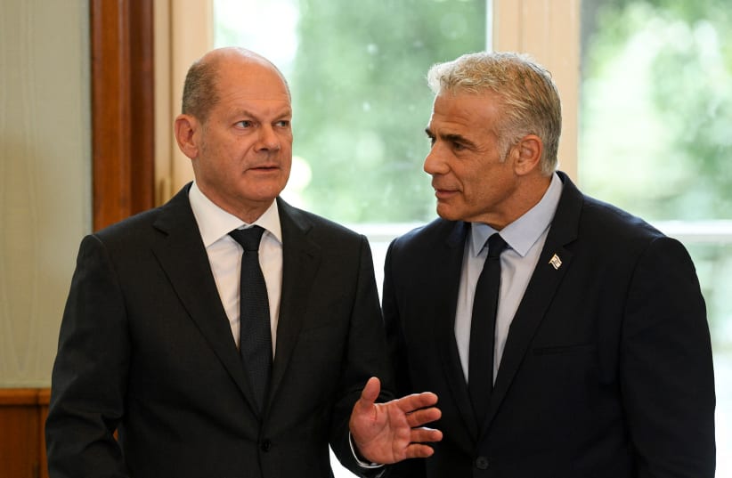 German Chancellor Olaf Scholz and Israeli Prime Minister Yair Lapid during the visit the house of the Wannsee Conference memorial in Berlin, Germany, September 12, 2022. (photo credit: REUTERS/ANNEGRET HILSE/POOL)