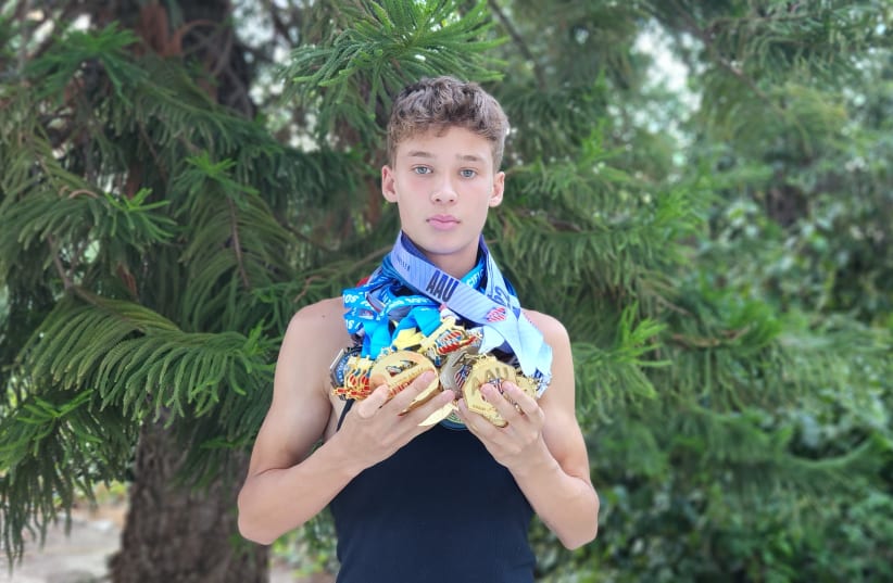  JJ Harel shows off his AAU medals. (photo credit: LUCY HAREL)