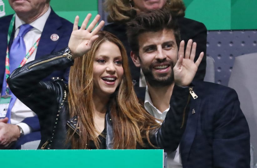  FC Barcelona player Gerard Pique with wife, Shakira during the match between Spain's Rafael Nadal and Canada's Denis Shapovalov, November 24, 2019. (photo credit: SERGIO PEREZ/REUTERS)