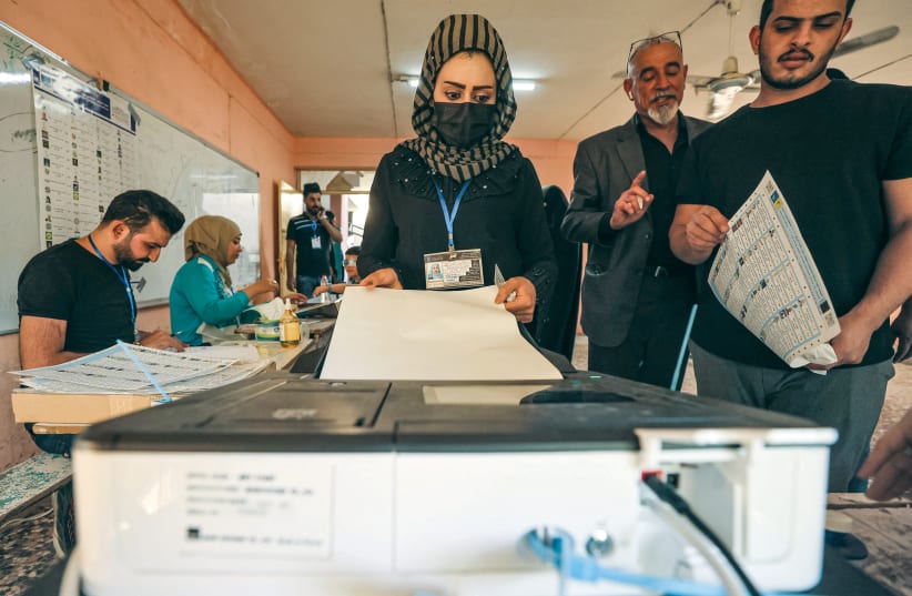  CASTING A vote in Iraqi elections, Baghdad, October 10, 2021. (photo credit: Ahmad al-Rubaye/AFP via Getty Images)