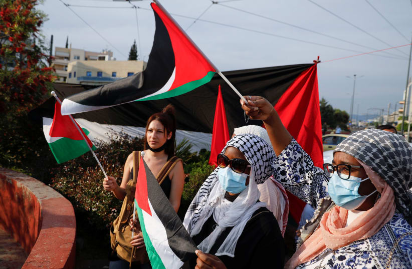  People take part in a protest outside the Israeli embassy  (photo credit: REUTERS/COSTAS BALTAS)