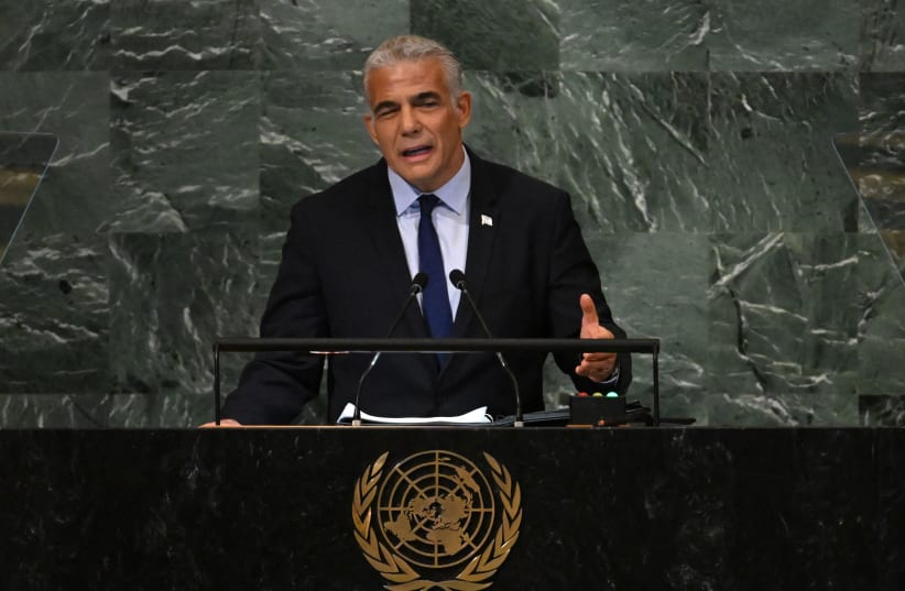  Israel's Prime Minister Yair Lapid addresses the 77th session of the United Nations General Assembly at the UN headquarters in New York City on September 22, 2022.  (photo credit: TIMOTHY A. CLARY/AFP via Getty Images))