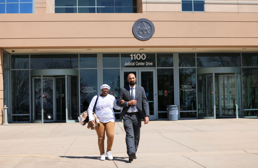  Sheneen McClain, the mother of Elijah McClain, who died in police custody in 2019 after he was subdued and injected with a sedative, leaves the Adams County Justice Center with her attorney Quasar Mohamedbhai in Brighton, Colorado, US, April 15, 2022. (photo credit: REUTERS/KEVIN MOHATT)