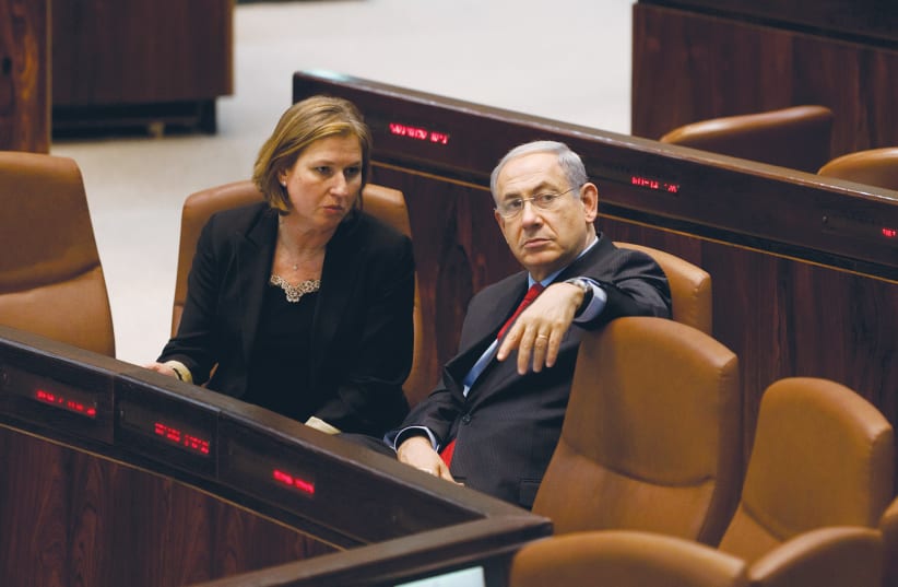  THEN-PRIME minister Benjamin Netanyahu sits with his justice minister Tzipi Livni in the Knesset plenum, 2013. If the leader of the largest party had the sole right to form the government, Livni would have become prime minister rather than Netanyahu in 2009. (photo credit: FLASH90)