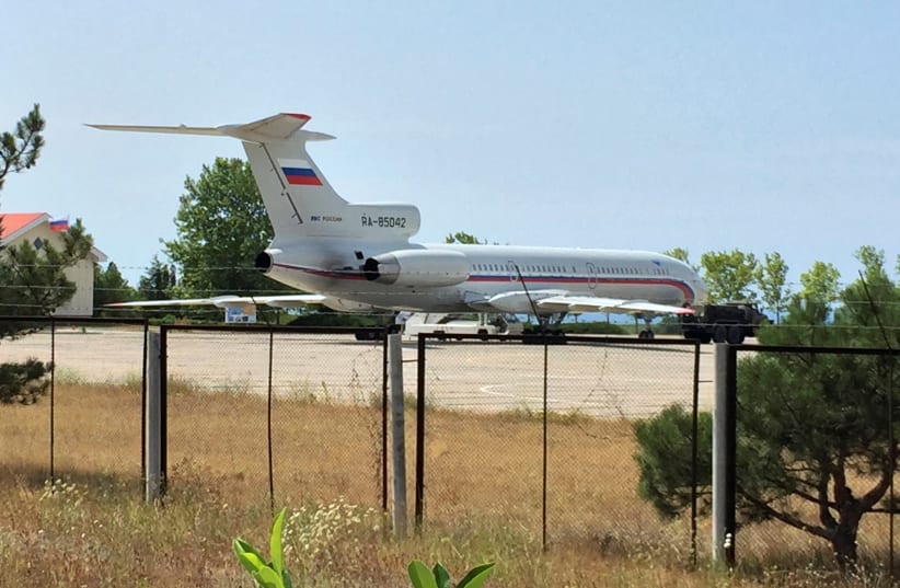 A view shows a Russian airforce plane at the Belbek airport near Sevastopol, Crimea (photo credit: REUTERS)
