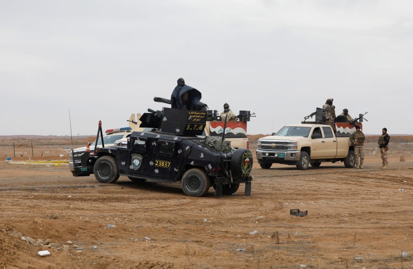  Vehicles of the Iraqi security forces gather near the Iraqi-Syrian border, January 27, 2022 (photo credit: REUTERS/KHALID AL-MOUSILY)