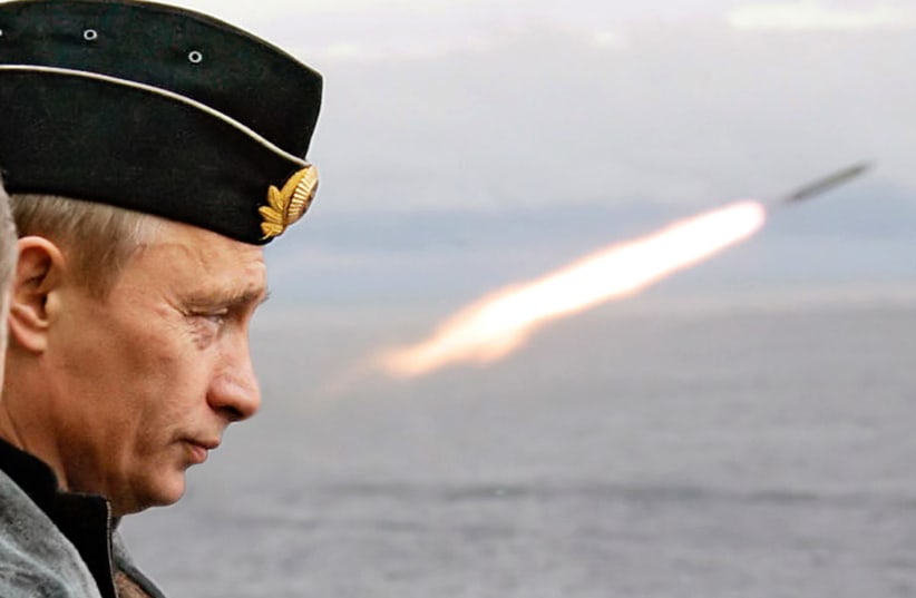  Russian President Putin watches the launch of a missile during naval exercises in Russia's Arctic (photo credit: REUTERS)