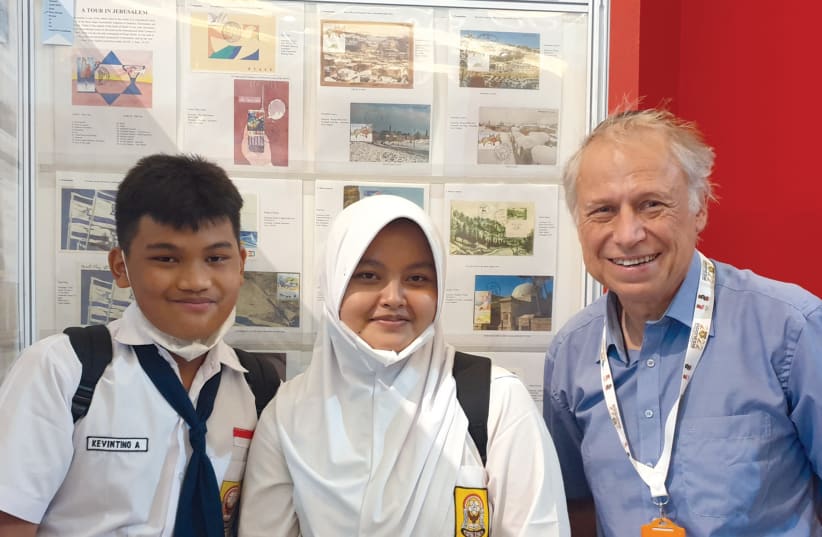  Indonesian schoolchildren pose for a photograph with the writer. (photo credit: LES GLASSMAN)