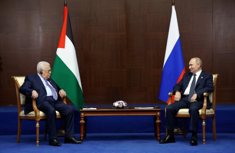  Russia's President Vladimir Putin and Palestinian President Mahmoud Abbas meet on the sidelines of the 6th summit of the Conference on Interaction and Confidence-building Measures in Asia (CICA), in Astana, Kazakhstan October 13, 2022. (photo credit: Sputnik/Vyacheslav Prokofyev/Pool via Reuters)