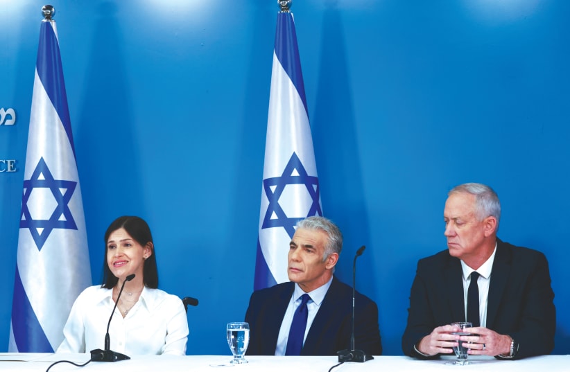  PRIME MINISTER Yair Lapid, Defense Minister Benny Gantz and Energy Minister Karin Elharrar hold a press conference on the maritime border deal with Lebanon, at the Prime Minister’s Office in Jerusalem, on Wednesday.  (photo credit: OLIVIER FITOUSSI/FLASH90)