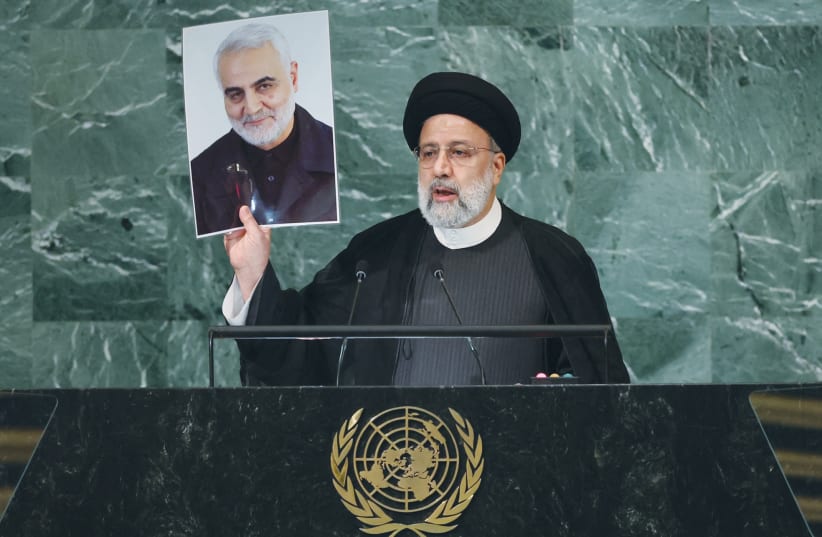  DURING HIS address to the UN General Assembly, last month, Iranian President Ebrahim Raisi holds up a picture of Quds Force Commander General Qassem Soleimani. This year, the Iranian curriculum includes passages commemorating Soleimani’s martyrdom. (photo credit: BRENDAN MCDERMID/REUTERS)