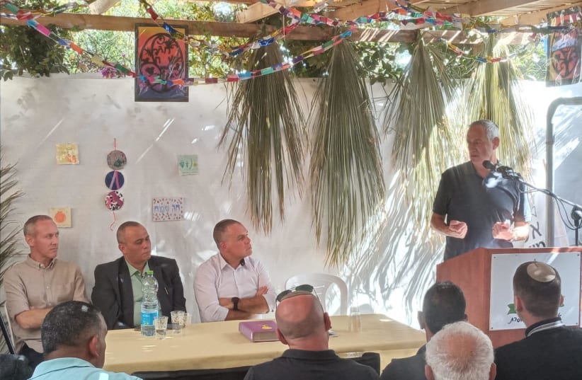 Defense Minister Benny Gantz visits sukkah event hosted by Efrat Council head Oded Revivi, October 16, 2022 (photo credit: EFRAT LOCAL COUNCIL)
