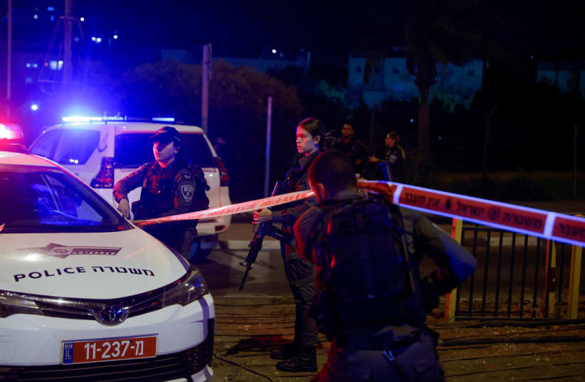  Police and rescue personnel at the scene of a terror attack at the entrance to the Jewish settlement of Ma’aleh Adumim, outside of Jerusalem, October 19, 2022. (photo credit: OLIVIER FITOUSSI/FLASH90)