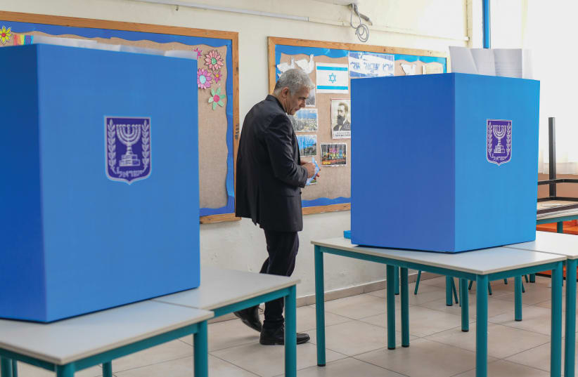  WHAT COMES next? Yair Lapid votes in March 2021. (photo credit: TOMER NEUBERG/FLASH90)