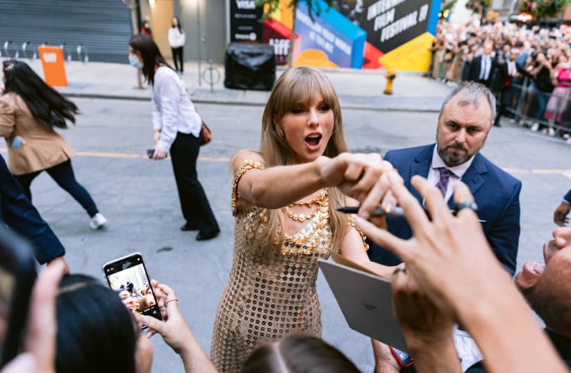  Taylor Swift greets fans before a conversation at the Toronto International Film Festival, Sept. 9, 2022. (photo credit: Wesley Lapointe/Los Angeles Times via Getty Images)